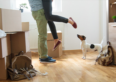 Man and woman celebrating buying their first house