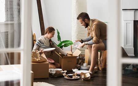 Couple unpacking in new home