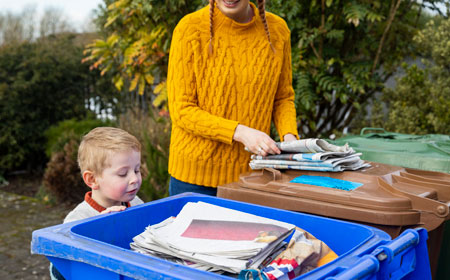 Mother and son recycling